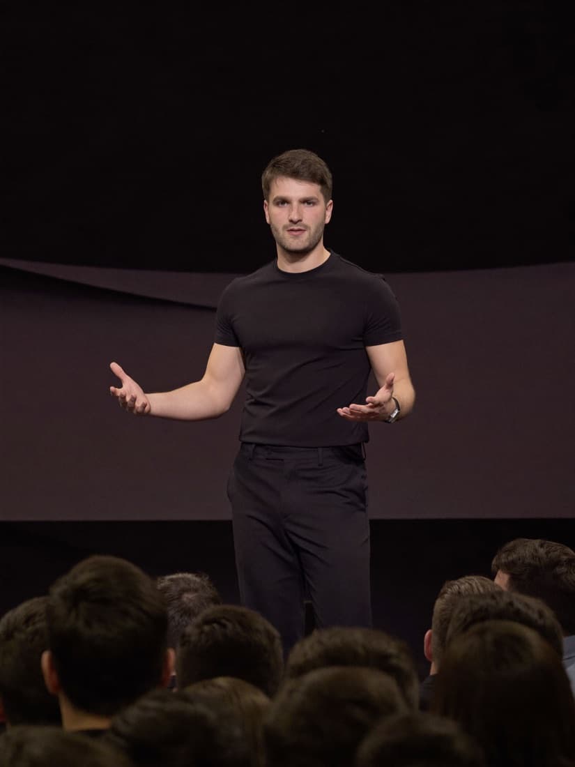 Ben Lane speaking to a room about AI for service businesses