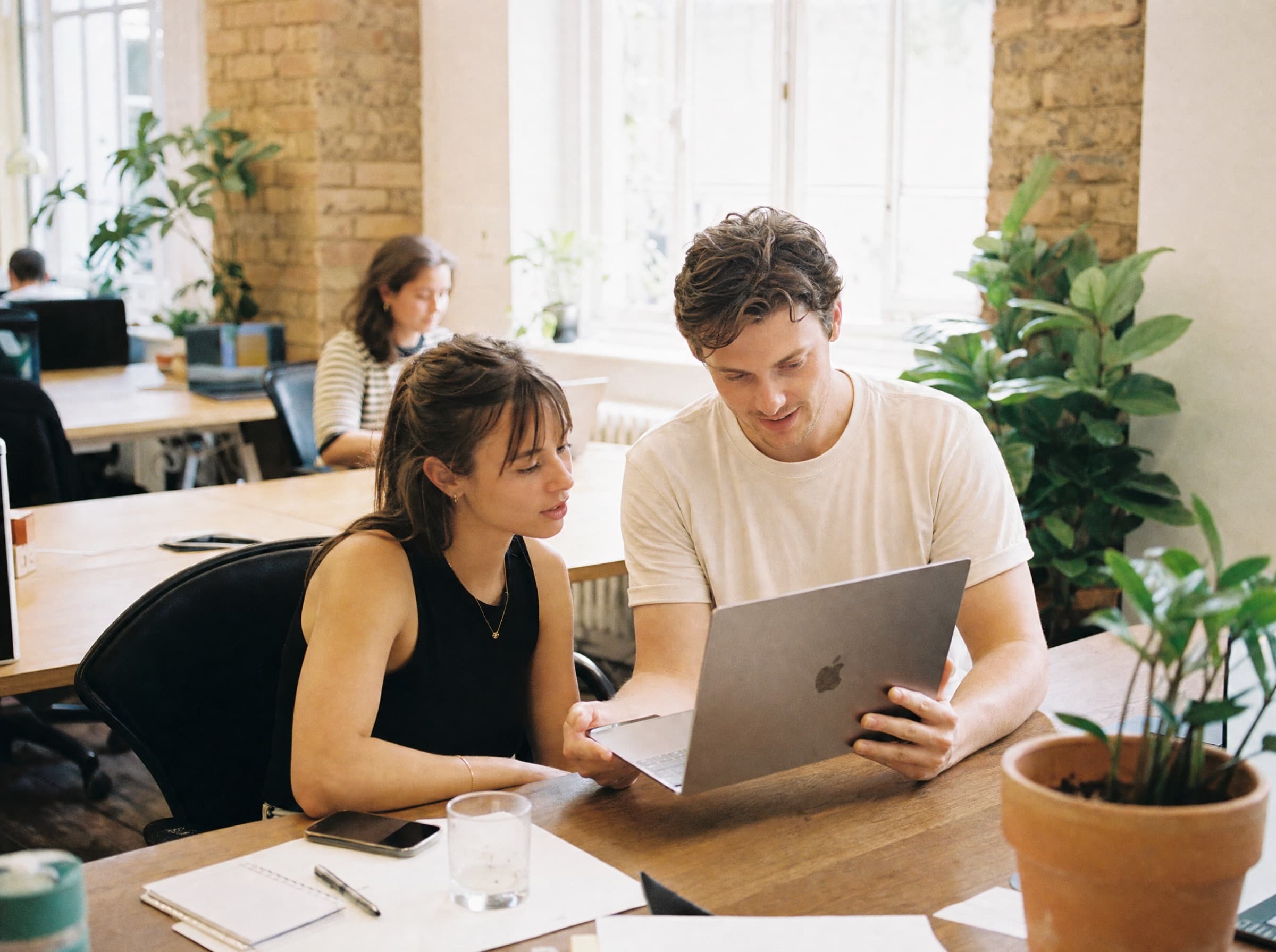 A team talking something through around a meeting table