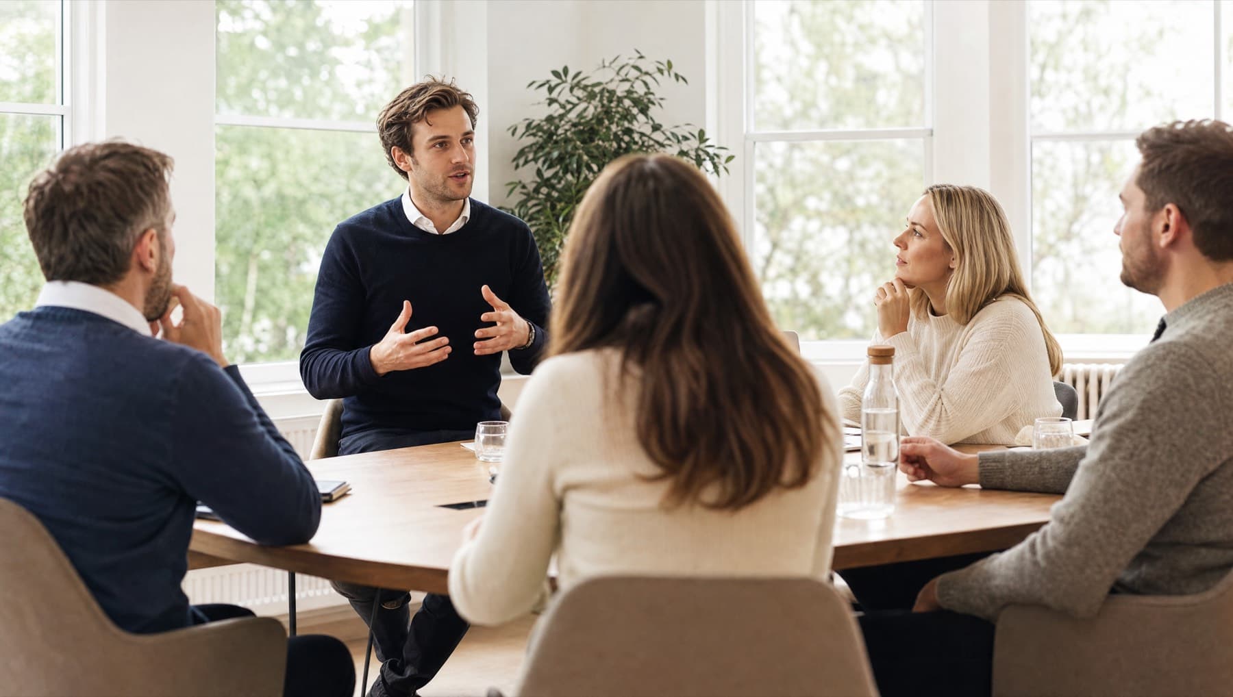 A small group working through something together at a table